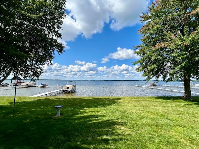 exterior space featuring a boat dock and a water view