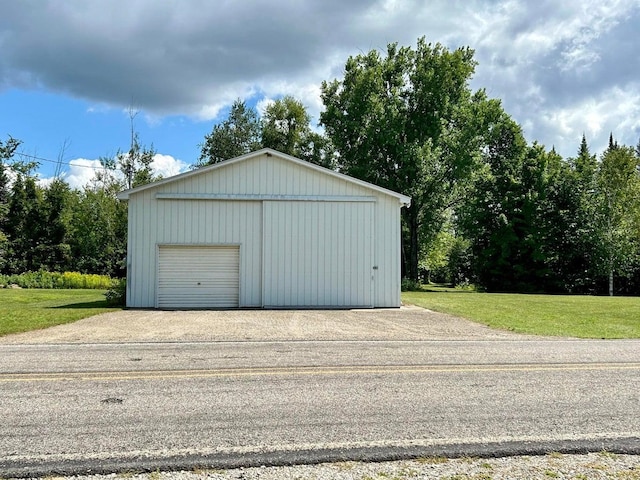 garage featuring a yard