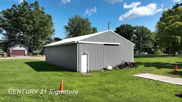 view of outbuilding featuring a lawn