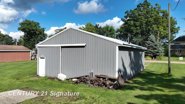 view of outbuilding with a lawn