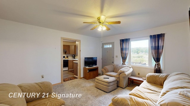 living room with light colored carpet and ceiling fan