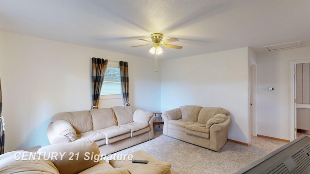 carpeted living room with ceiling fan