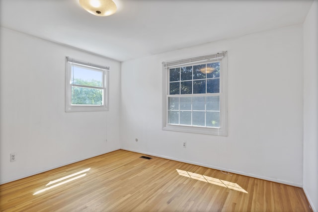 unfurnished room featuring wood-type flooring