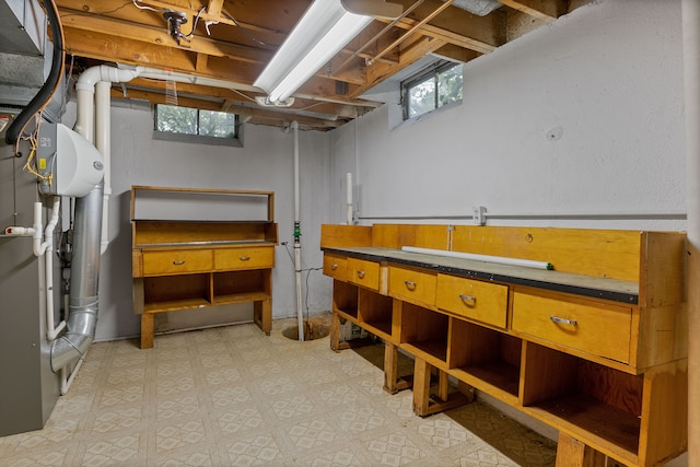 basement with a workshop area and plenty of natural light