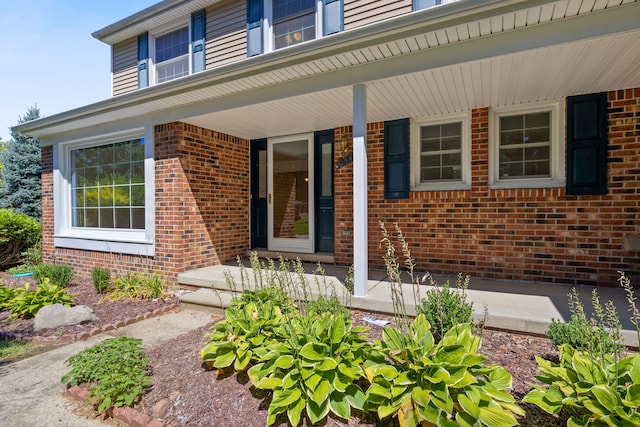 view of exterior entry featuring a porch