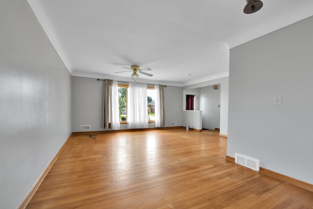 spare room featuring light hardwood / wood-style flooring and ceiling fan