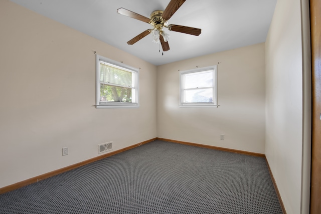 spare room with ceiling fan and carpet floors