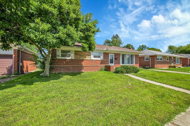 ranch-style home featuring a front yard