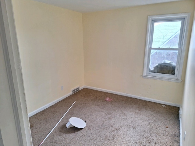 spare room with carpet floors