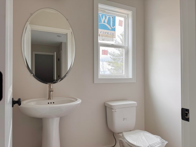 bathroom with sink and toilet