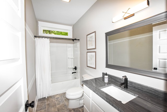 full bathroom featuring shower / bath combo, toilet, and vanity