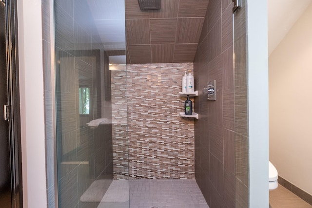 bathroom with toilet and walk in shower