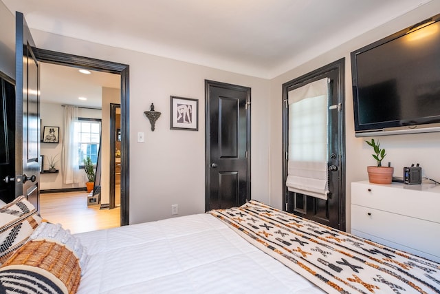 bedroom with light hardwood / wood-style flooring