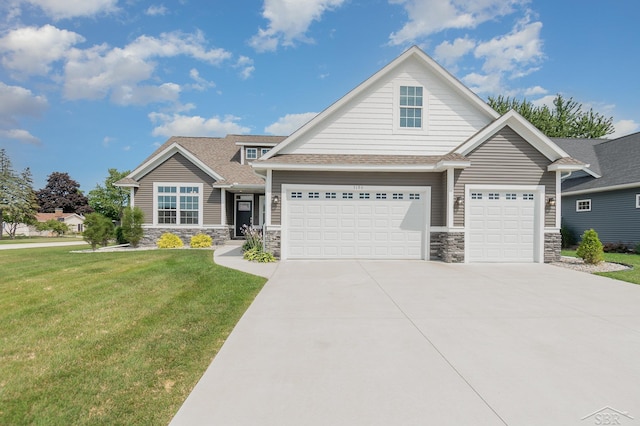 craftsman inspired home with a front lawn and a garage