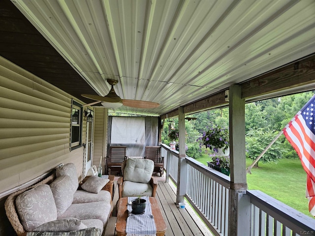 wooden deck with ceiling fan and covered porch