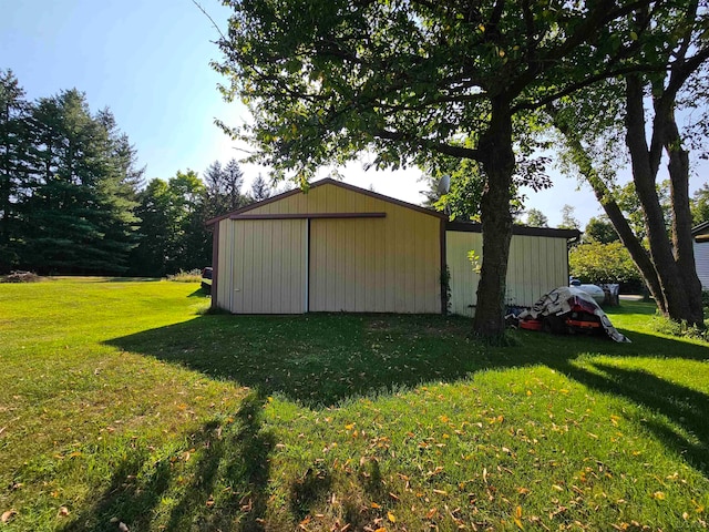 view of outdoor structure with a lawn