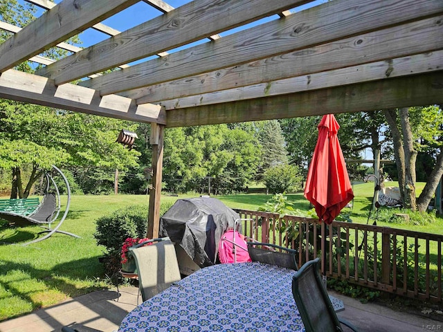 wooden terrace with a pergola, grilling area, and a lawn