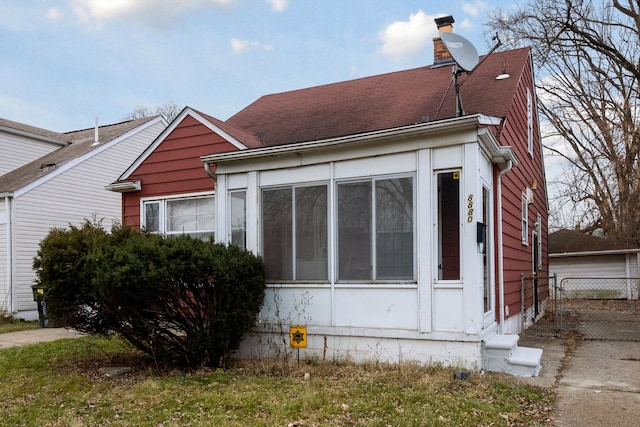 view of home's exterior featuring a sunroom