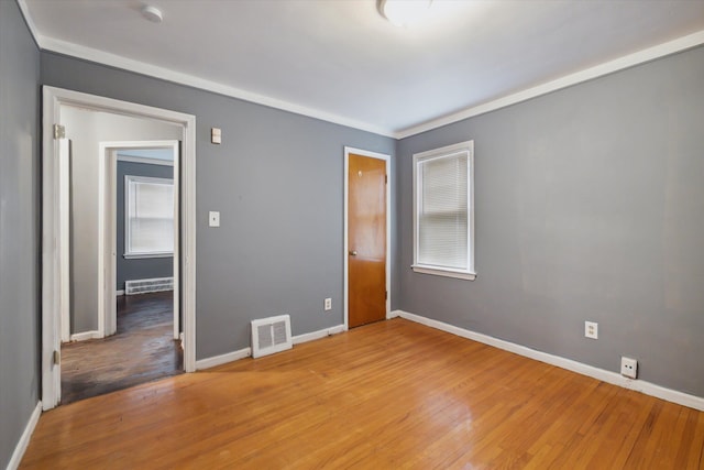 unfurnished bedroom with wood-type flooring