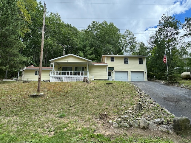 view of front of house featuring a garage and covered porch