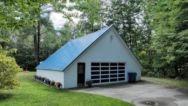 garage featuring a yard