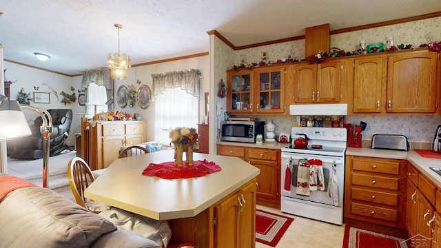 kitchen with white range with electric cooktop, a kitchen island, pendant lighting, and ornamental molding