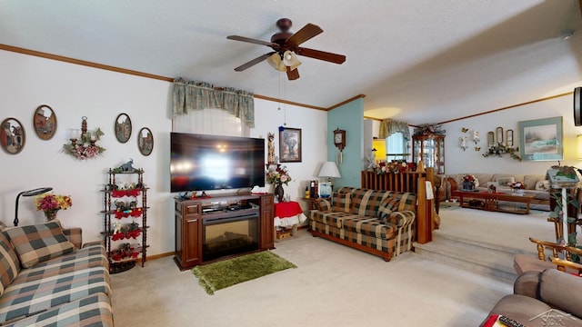 living room with a textured ceiling, light colored carpet, ceiling fan, and crown molding