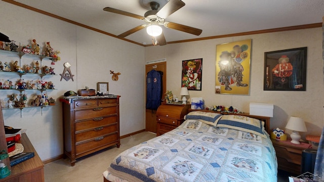 carpeted bedroom featuring ceiling fan and crown molding