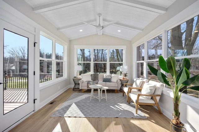 sunroom / solarium featuring vaulted ceiling with beams, ceiling fan, and plenty of natural light