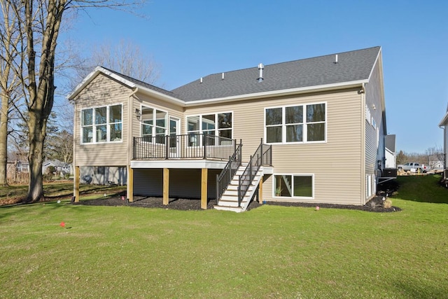 rear view of house with a lawn