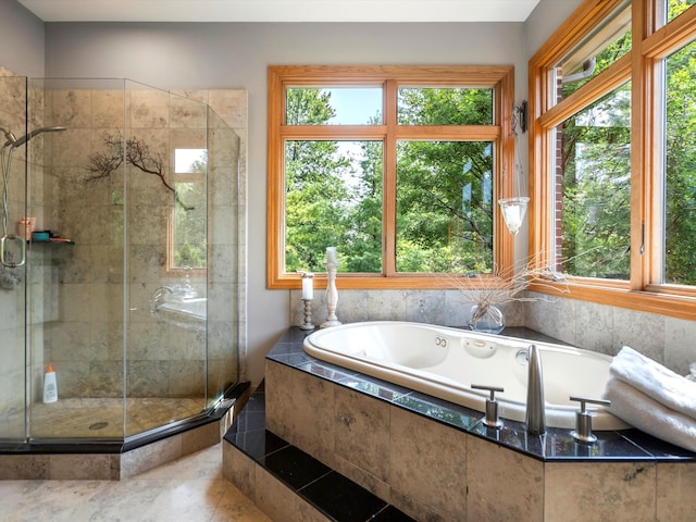 bathroom featuring tile patterned floors, a healthy amount of sunlight, and plus walk in shower