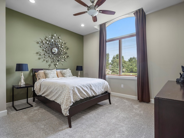 carpeted bedroom featuring ceiling fan