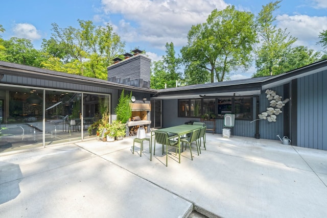 view of patio / terrace featuring a fireplace