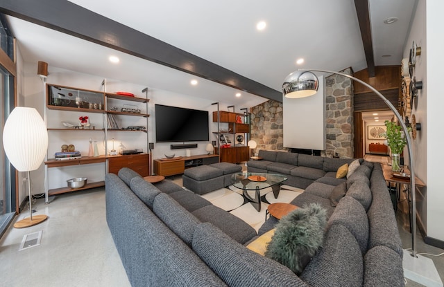 living room with vaulted ceiling with beams