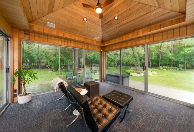 unfurnished sunroom featuring lofted ceiling, wooden ceiling, and ceiling fan