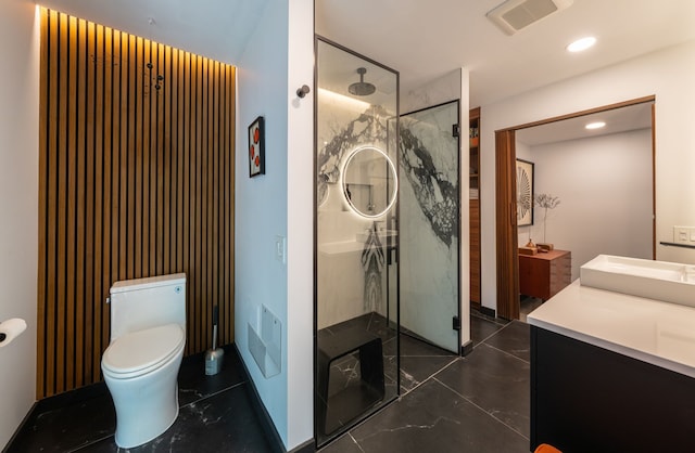 bathroom featuring walk in shower, vanity, and toilet