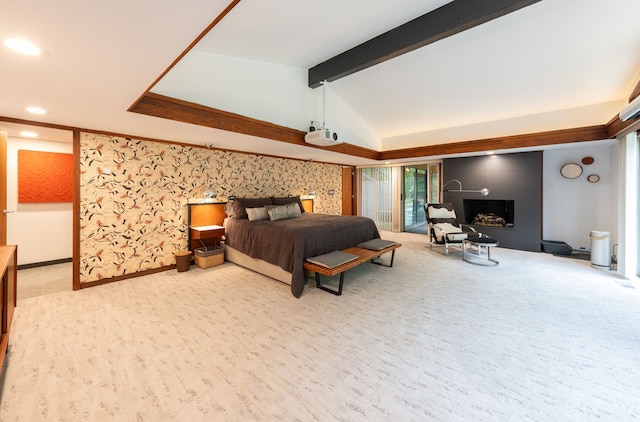 carpeted bedroom with access to exterior, a fireplace, and lofted ceiling with beams