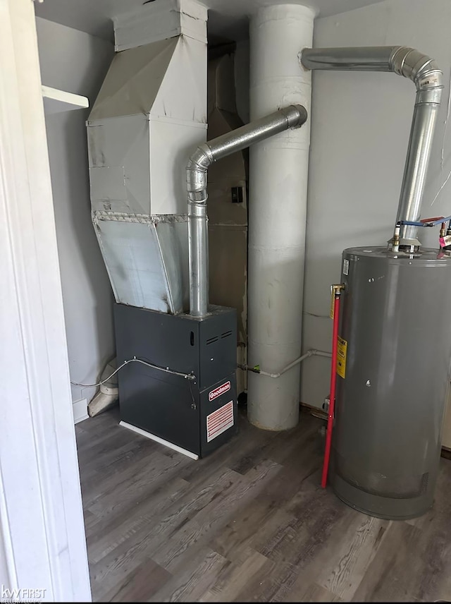 utility room with heating unit and water heater