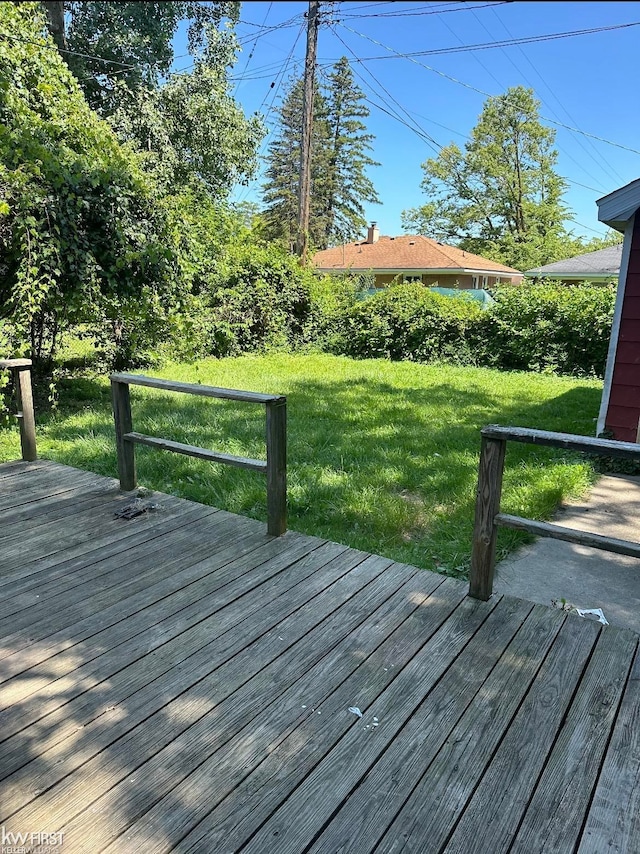 wooden deck with a yard