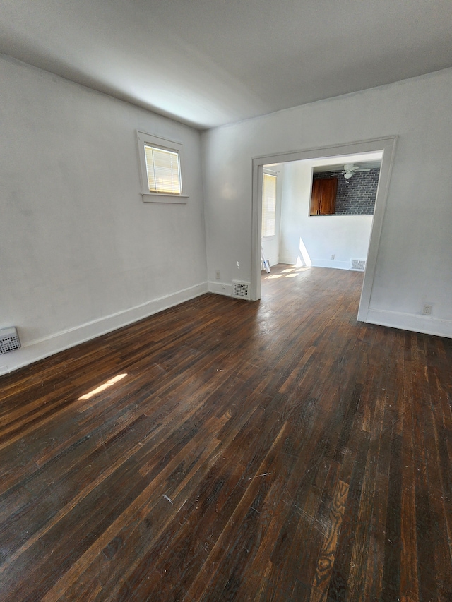 spare room featuring dark hardwood / wood-style flooring