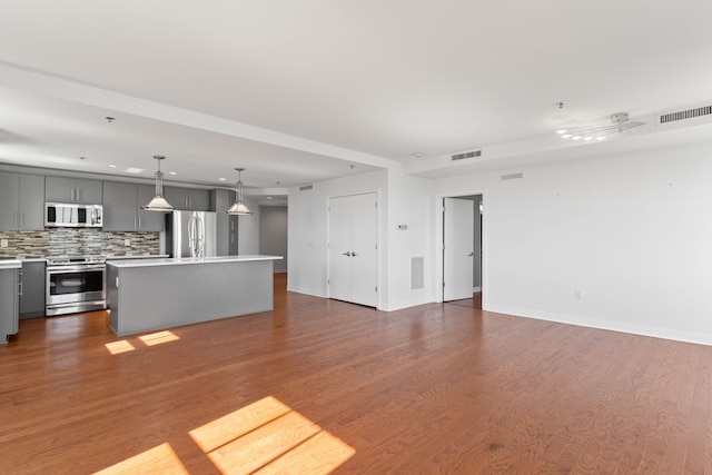 unfurnished living room featuring dark hardwood / wood-style floors