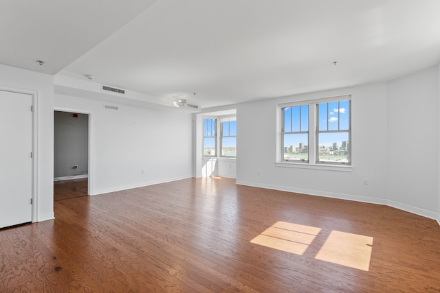 unfurnished room featuring hardwood / wood-style floors