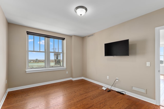 spare room featuring hardwood / wood-style flooring