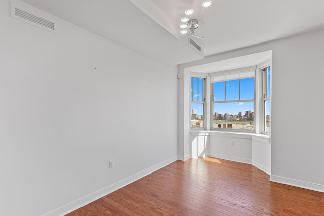 empty room featuring hardwood / wood-style floors