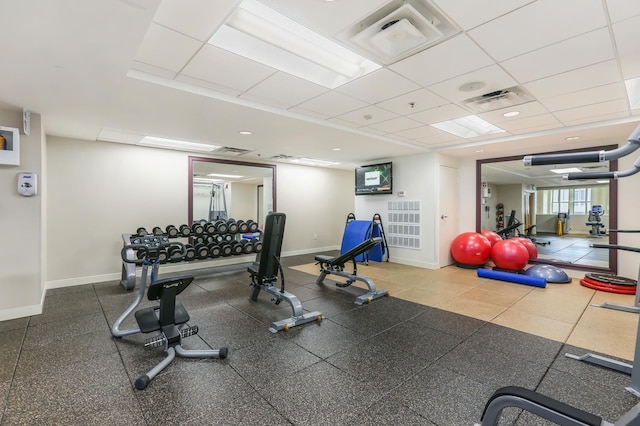 workout area featuring a drop ceiling