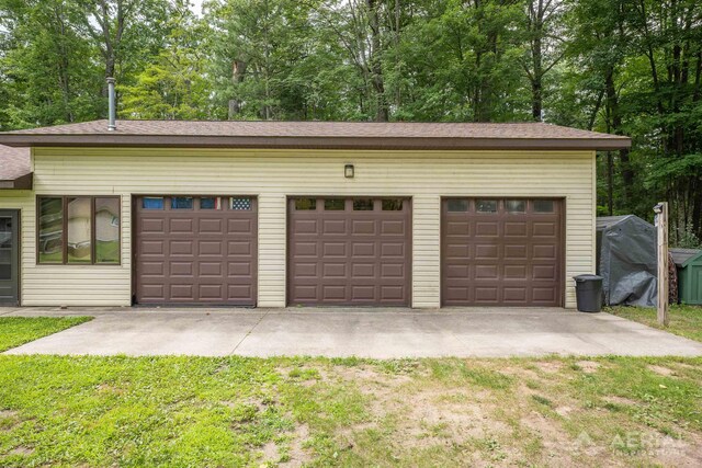 4100 Grass Lake Rd, West Branch, MI 48661 - garage featuring driveway