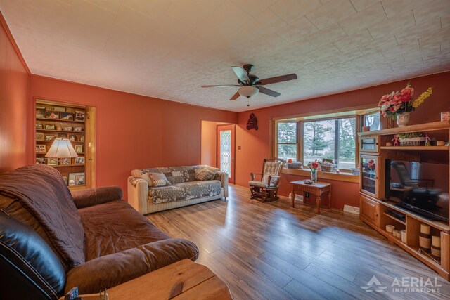 4100 Grass Lake Rd, West Branch, MI 48661 - living room featuring wood finished floors and ceiling fan