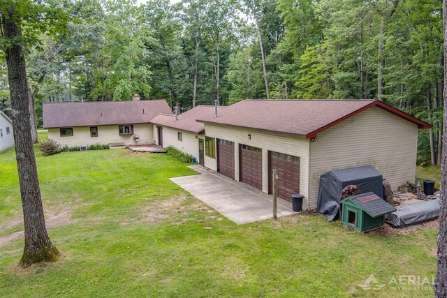 4100 Grass Lake Rd, West Branch, MI 48661 - view of front of house featuring a front lawn and roof with shingles
