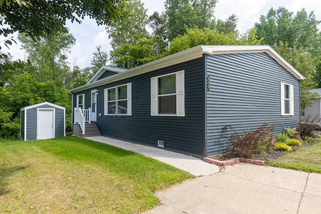 view of side of home featuring a storage shed and a lawn