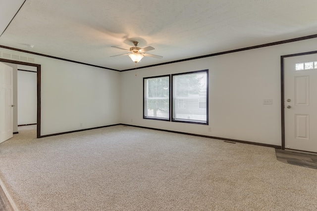 interior space with plenty of natural light, light colored carpet, and a textured ceiling